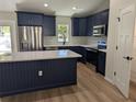 Beautiful kitchen with a center island, modern appliances, and sleek countertops at 6276 Nw 65 Nw Pl, Ocala, FL 34482