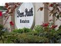 Deer Path Estates Community sign with greenery and flowers at 6279 Se 8Th Lane, Ocala, FL 34472