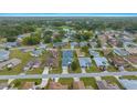 Picturesque residential area with neatly arranged homes, lush greenery, and a serene lake at 7178 Sw 113Th Loop, Ocala, FL 34476