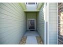 Stylish entryway features stone accents and a welcoming modern door at 7374 Sw 77Th Ave, Ocala, FL 34481