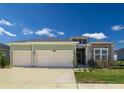 Charming single-Gathering home featuring a two-car garage, well-manicured lawn and pleasing curb appeal at 7374 Sw 77Th Ave, Ocala, FL 34481