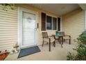 Welcoming front porch area with cozy seating, a charming entrance, and ample natural light at 8382 Sw 109Th Lane Rd, Ocala, FL 34481