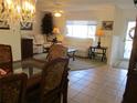 Inviting living room with chandelier and view to the sofas and window at 11552 Sw 138Th Ln, Dunnellon, FL 34432