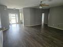 Bright and airy living room featuring hardwood floors and a ceiling fan at 2637 Ne 27Th St, Ocala, FL 34470