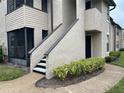 Exterior view with steps leading up to a unit, showcasing the building's architecture at 2923 Antique Oaks Cir # 39, Winter Park, FL 32792