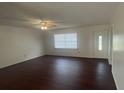 Spacious living room featuring wood floors and plenty of natural light at 4 Pine Pass Ter, Ocala, FL 34472