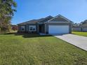 Beautiful single story home with manicured lawn and driveway, lots of curb appeal at 4838 Sw 130Th St, Ocala, FL 34473