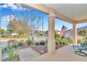 Inviting front porch with views of the well maintained landscaped yard at 8245 Sw 78Th Terrace Rd, Ocala, FL 34476
