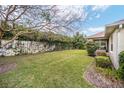 Lush backyard featuring a well-maintained lawn and privacy fencing at 8670 Sw 88Th Pl, Ocala, FL 34481