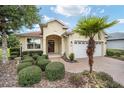 Charming single-story home featuring a manicured front yard and a welcoming entrance at 8670 Sw 88Th Pl, Ocala, FL 34481