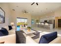 Bright and airy living room flows seamlessly into the modern kitchen, creating an open concept living space at 9594 Se 61St Ter, Belleview, FL 34420