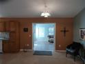 Open concept home with tile and carpet flooring with a clear view to another room at 1546 Sw 153Rd Sw Ct, Ocala, FL 34481