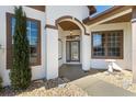 Inviting front entrance featuring decorative stonework and manicured landscaping at 17818 Se 120Th Ct, Summerfield, FL 34491