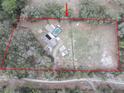 Overhead shot showcasing the property's layout including the home, pool, outbuildings and expansive lot at 5490 Se Highway 42, Summerfield, FL 34491