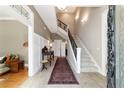 Elegant foyer with staircase and decorative wainscoting at 905 Se 12Th St, Ocala, FL 34471