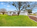 Green grass, well-manicured lawn, and a charming single-story home in a peaceful neighborhood at 9493 Se 173Rd Ln, Summerfield, FL 34491