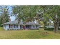 Charming single-story home with mature landscaping and a welcoming front porch at 1225 Se 16Th St, Ocala, FL 34471