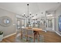 Open dining area with access to the patio, complemented by a view of the modern kitchen at 1986 Altamonte Way, The Villages, FL 32162