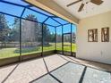 Bright, screened patio features brick flooring and views of the backyard at 9480 Sw 76Th St, Ocala, FL 34481