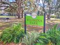 Wyomina Park sign featuring lush greenery, inviting atmosphere, and neighborhood charm at 1022 Ne 11Th Ave, Ocala, FL 34470