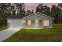 Attractive single-story home with a well-manicured lawn and a cozy front porch at 107 Sw Alvarez Rd, Dunnellon, FL 34431