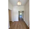 Bright foyer featuring wood-look flooring and an open view into the living space at 13042 Sw 60Th Court Rd, Ocala, FL 34473