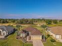 Lovely home with lush green surroundings and a pristine golf course view at 13128 Se 97Th Terrace Rd, Summerfield, FL 34491