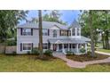 Charming two-story home with unique turret design and a welcoming front porch at 1628 Se 29Th Ter, Ocala, FL 34471
