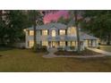 Charming two-story home featuring a welcoming front porch and a unique turret design at 1628 Se 29Th Ter, Ocala, FL 34471