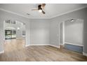An elegant living room featuring wood flooring, recessed lighting, and a ceiling fan at 1628 Se 29Th Ter, Ocala, FL 34471