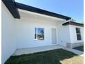 Close-up of the home's entrance highlighting the modern design and stone accents at 2602 Sw 154Th Ln, Ocala, FL 34473
