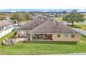 Spacious backyard featuring a stone firepit, patio seating area, and a well-kept lawn at 4839 Sw 63Rd St, Ocala, FL 34474