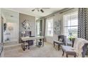 Stylish office space featuring neutral decor, a work desk, elegant seating, and bright natural lighting at 4266 Sw 53Rd Lane Rd, Ocala, FL 34474
