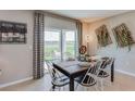 Charming dining area with decorative wall art and view of a lake at 4267 Sw 53Rd Lane Rd, Ocala, FL 34474