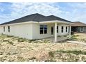 A modern home with a covered patio, expansive backyard, and excellent natural light at 4381 Sw 90Th Pl, Ocala, FL 34476