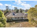Lovely single-story house with a well-maintained lawn and mature trees at 5926 Ne 62Nd Court Rd, Silver Springs, FL 34488