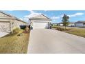 Charming single-Gathering home featuring a two-car garage and well-manicured lawn and landscaping at 7935 Sw 89Th Ter, Ocala, FL 34481