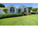Charming single-story home featuring meticulously landscaped front yard at 8832 Sw 108Th St, Ocala, FL 34481