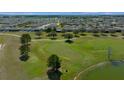 Aerial view of a home, golf course and the community, showcasing its desirable location and attractive surroundings at 8825 Sw 57Th Place Rd, Ocala, FL 34481