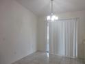 Bright dining area with tile floor, light fixture, and sliding glass door to the patio at 15756 Sw 37Th Cir, Ocala, FL 34473
