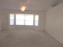 Spacious living room with a large bay window allowing for lots of natural light at 15756 Sw 37Th Cir, Ocala, FL 34473