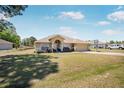 Charming single-story home featuring a two-car garage and well-maintained front lawn at 17 Pine Course Loop, Ocala, FL 34472