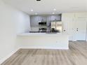 Eat-in kitchen with modern countertops, stainless steel appliances, and hardwood floors at 31 Juniper Pass Ln, Ocala, FL 34480