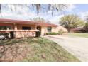 Charming single-story home with a well-manicured front yard and a spacious driveway at 3447 Sw 19Th Pl, Ocala, FL 34474