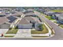 An elevated view of the home in a neighborhood, showing the fenced yard and proximity to other properties at 8371 Sw 59Th Ter, Ocala, FL 34476