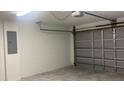 Spacious two car garage with clean, white walls and an automatic garage door opener at Tbd Malauka Rd, Ocklawaha, FL 32179