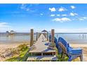 Wooden dock with a gazebo extending into the water, with stacked chairs at 12336 E Highway 25, Ocklawaha, FL 32179