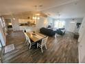 Bright, airy living space with modern furnishings and a dining area at 15055 Se 93Rd Ct, Summerfield, FL 34491