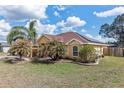 Spacious single Gathering home with solar panels and manicured landscaping at 234 Locust Pass Loop, Ocala, FL 34472
