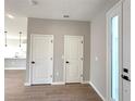 Bright foyer featuring tile flooring, two-door closet, and view into open-concept area and large front door with sidelight at 3628 Sw 133Rd Loop, Ocala, FL 34473